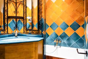 a bathroom with a sink and a mirror at Villa Royale Montsouris in Paris +13 photos