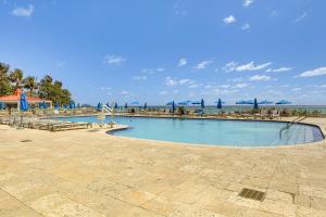 The swimming pool at or close to Ocean Views and Resort Perks Sunny Isles Beach Unit