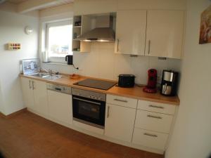 Kuchyň nebo kuchyňský kout v ubytování Villa Seeblick - Nordhorn
