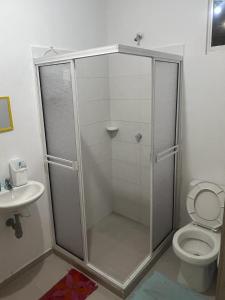 a shower stall in a bathroom with a toilet at Casa amoblada festival vallenato in Valledupar