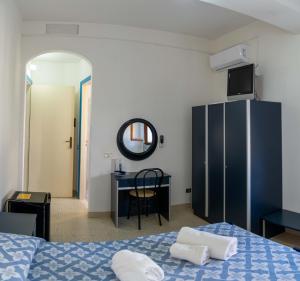 Postel nebo postele na pokoji v ubytování Hotel dei Focesi