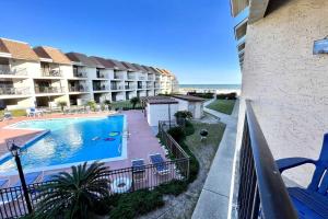 a view from a balcony of a hotel with a swimming pool at Gulfside Townhome 13 Townhouse in Gulf Shores