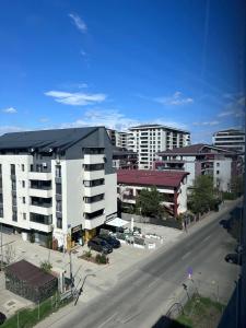 an aerial view of a city with buildings and a street at Diamant residence - self check in & free parking in Bragadiru