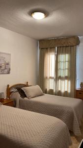 Postel nebo postele na pokoji v ubytování Sun&Relax Apto 2dormitorios 6-7pWifi&Piscina