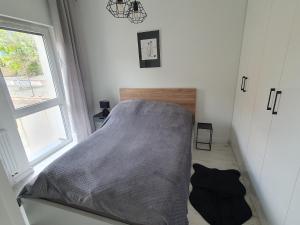 Postel nebo postele na pokoji v ubytování EDEN Apartament