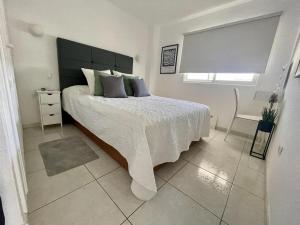 Ένα ή περισσότερα κρεβάτια σε δωμάτιο στο Comodoro 7 - One Bed