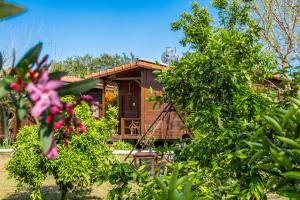 a cabin in the woods with plants at Cirali La Maison Hotel in Kemer