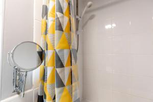 a bathroom with a mirror and a shower curtain at Park Green in Stockton-on-Tees