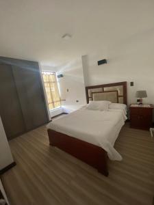 Postel nebo postele na pokoji v ubytování Pent House Exclusivo + 12 fotografií