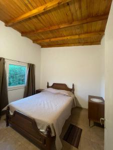 Giường trong phòng chung tại PH en Colinas Verdes, Sierra de los Padres