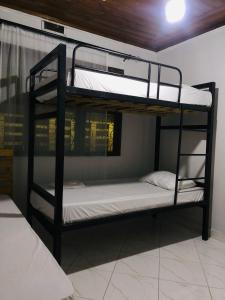 a couple of bunk beds in a room at Nest Haven Homestay-Hostel in Dar es Salaam