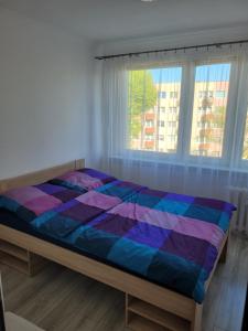 Säng eller sängar i ett rum på Koszalińska 6