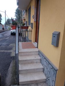a set of stairs outside of a building with a mailbox at MyrEma House - near Fontanarossa Airport Catania in Catania