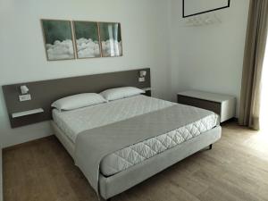 Postel nebo postele na pokoji v ubytování Le Nereidi Green Resort Elisa