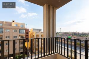 a balcony with a view of a city at Prime Residence Point 90 in Cairo