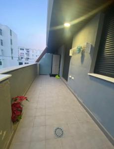 an empty hallway of a building with a window at Balcón del atardecer in Barbate +1 photo