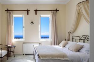 Ikio Concept Santorini客房内的一张或多张床位