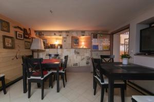 a dining room with a table and chairs at Vila Fortuna - Art O'Clock in Sibiu