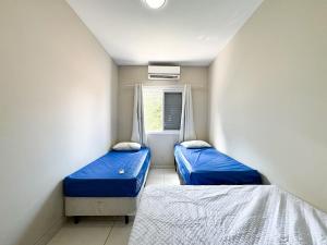 En eller flere senge i et værelse på Casa com Hidro Spa a 100m da Praia