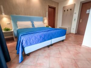 Voodi või voodid majutusasutuse Hotel Martino toas