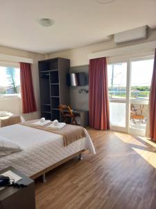 Ένα ή περισσότερα κρεβάτια σε δωμάτιο στο Pousada Vista da Barra +62 φωτογραφίες
