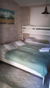 a bedroom with a large bed in a room at Helena in Trzin
