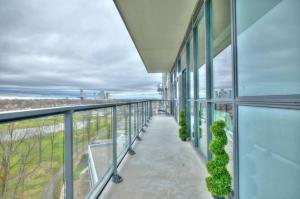an office building balcony with a view of the water at Penthouse on the Green in Niagara Falls