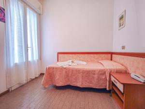 Postel nebo postele na pokoji v ubytování Hotel Rosa