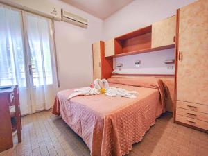 Postel nebo postele na pokoji v ubytování Hotel Rosa