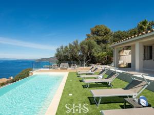 a villa with a swimming pool and the ocean at Villa Belle View in Torre delle Stelle +75 photos