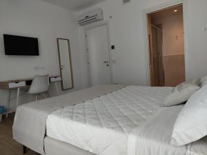 Postel nebo postele na pokoji v ubytování Le Nereidi Green Resort Filippo