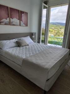 Postel nebo postele na pokoji v ubytování Le Nereidi Green Resort Filippo