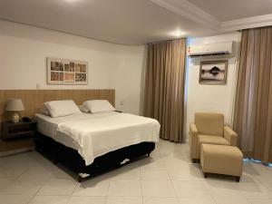 Tempat tidur dalam kamar di Millenium Hotel Flat