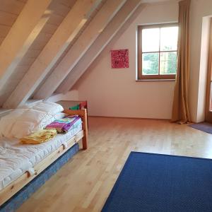 Postel nebo postele na pokoji v ubytování Jurasonne
