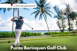 a man swinging a golf club on a golf course at Relax Home Plenty Space Near The Airport - 4min in Aguadilla