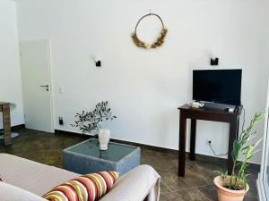 TV a/nebo společenská místnost v ubytování Appartement Coco