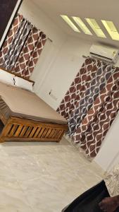 a room with stairs with brown and white tiles at Royal Square Service Apartment in Thrissur Town in Trichūr