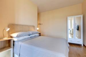 Ένα ή περισσότερα κρεβάτια σε δωμάτιο στο Florence Holiday Homes Casa Belfiore