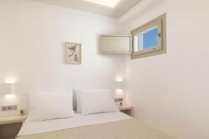 Postel nebo postele na pokoji v ubytování Windmillside Luxury Villas
