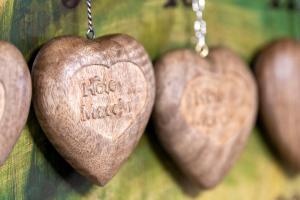 a group of hearts hanging on a wall at Hôtel Macchi Restaurant & Spa in Châtel