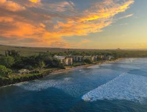 an aerial view of a beach at sunset at Kanai A nalu in Wailuku