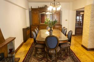 a dining room with a table and chairs at Grand Egyptian Museum Pyramids Apartment in Cairo