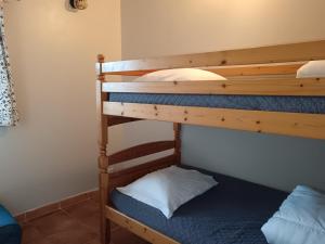 a couple of bunk beds in a room at Mas de la Tour Carbonnière in Aigues-Mortes