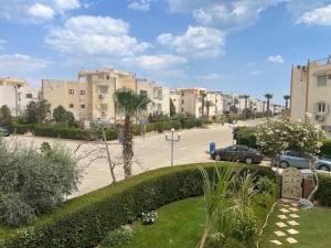a view of a street in a city with buildings at 2 Bedroom Chalet, Private Garden Ain El Sokhna in Ain Sokhna
