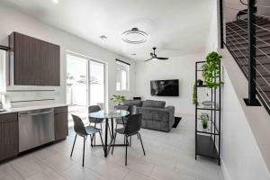 a kitchen and living room with a table and chairs at Modern Townhome in Arcadia ~ Pool & Private Yard in Phoenix