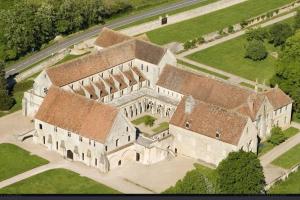 an aerial view of a large building with turrets at Gite de la grange 14 couchages in Saint-Amand-Montrond
