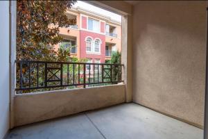 an empty balcony with a window in a building at spacious two bedroom 2 bath close to Disney Adventure Park in Anaheim