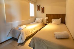 เตียงในห้องที่ Asunción Rent Suites Santa Teresa