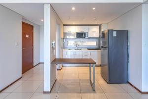 ครัวหรือมุมครัวของ Asunción Rent Suites Santa Teresa