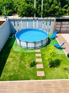 a model of a swimming pool in a yard at AzulRest Casa de Verano in Juan de Acosta